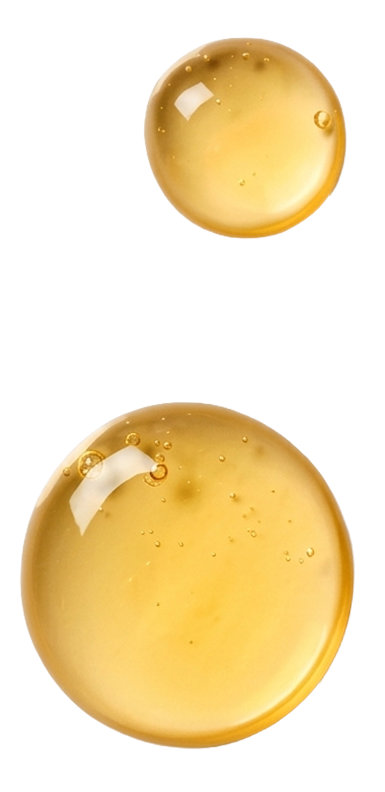 Two droplets of yellow Baobab liquid on a white background